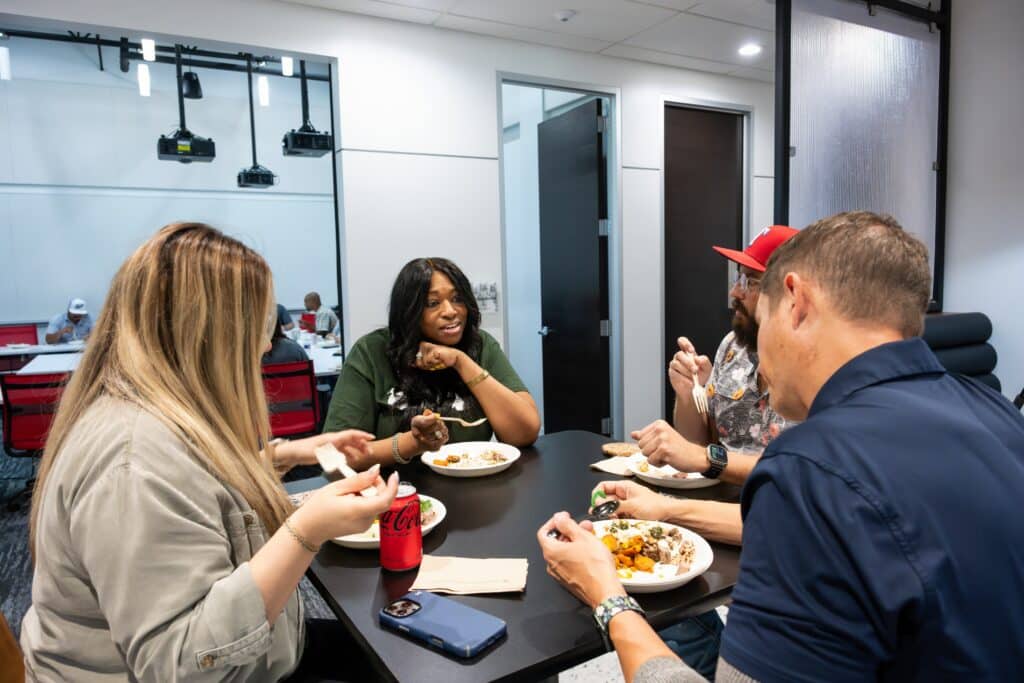 construction team lunch gathering workplace connection and wellness