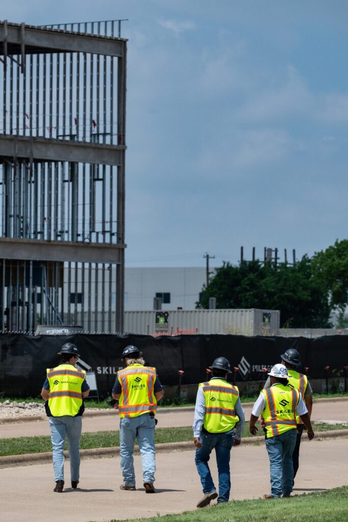 Skiles Group project team walks the Texas Health Huguley campus construction site in Burleson.