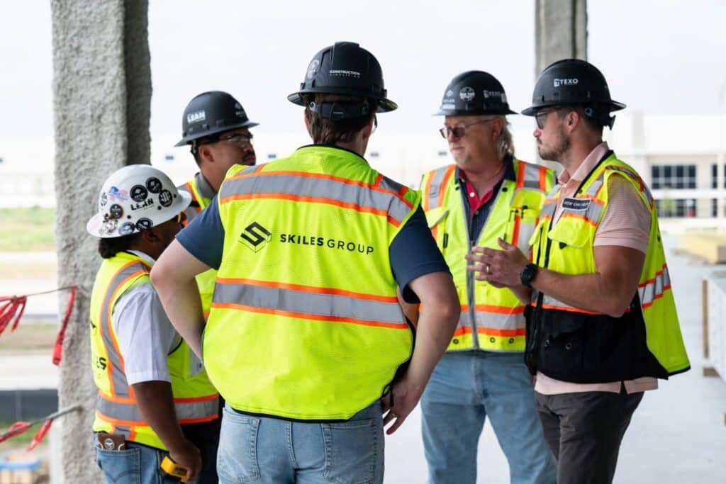 Skiles Group team members discuss project coordination inside the Texas Health Huguley Medical Office Building.