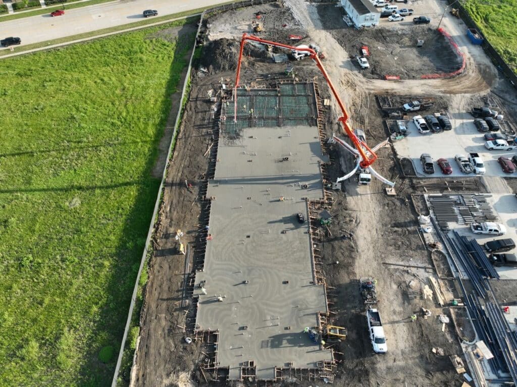 Aerial view of the structural slab concrete pour underway at the TMI Sports Medicine ASC project in Grand Prairie.